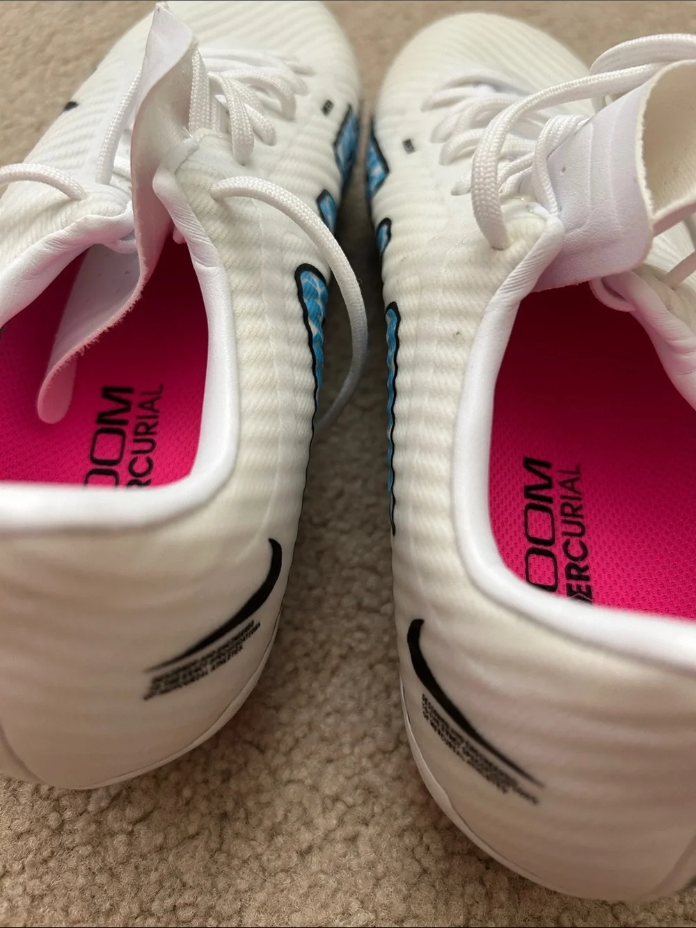 Nike Women's White Soccer Cleats with Blue Graphics and Pink Insole